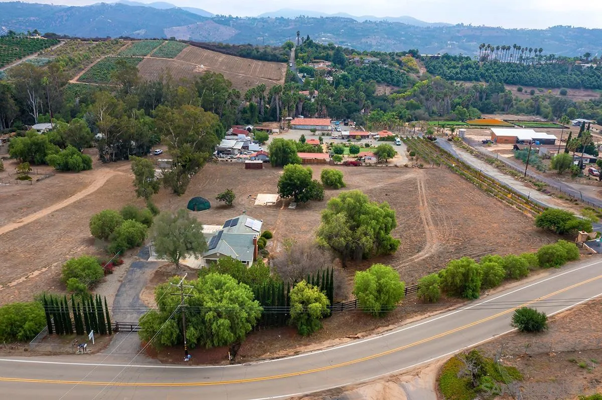 6777 West Lilac Road Bonsall, CA 92003 - Photo 3 of 36 an aerial view of a city with mountains