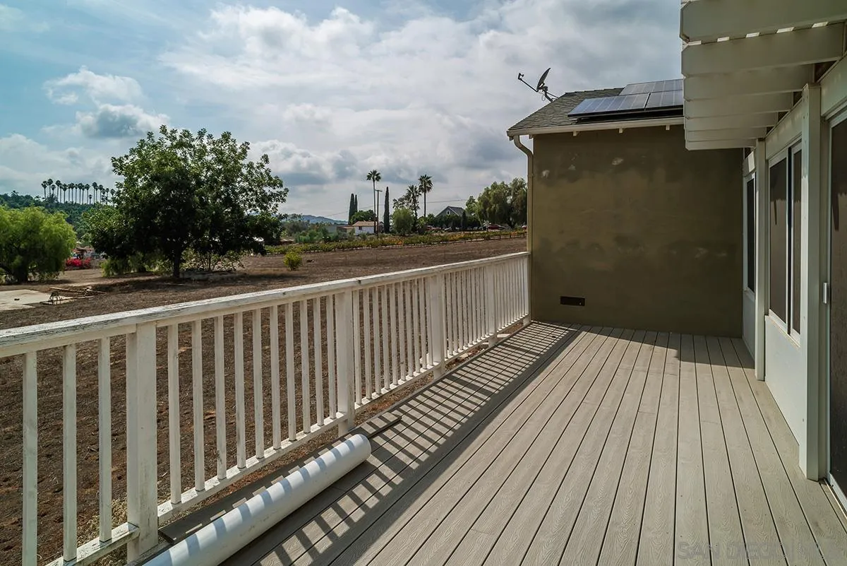 6777 West Lilac Road Bonsall, CA 92003 - Photo 33 of 36 a view of a balcony with wooden floor