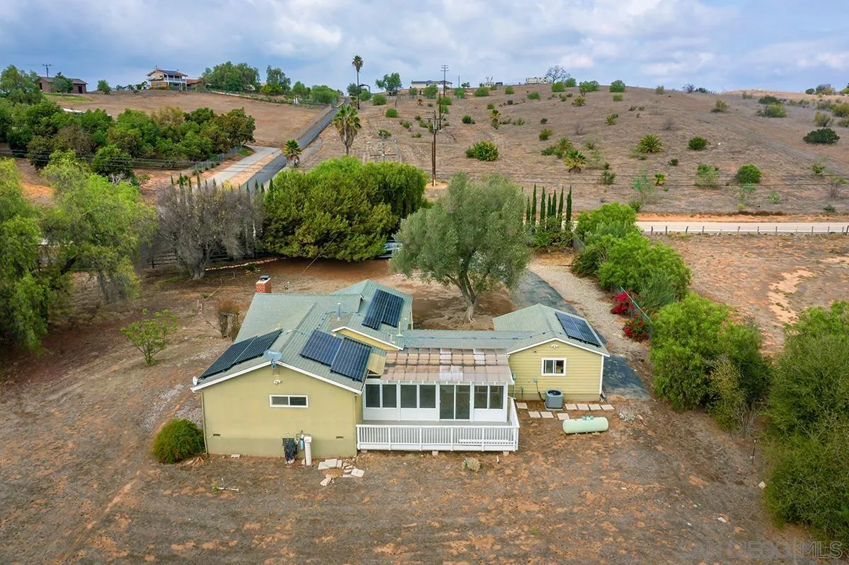 6777 West Lilac Road Bonsall, CA 92003 - Photo 34 of 36 an aerial view of a house with a garden
