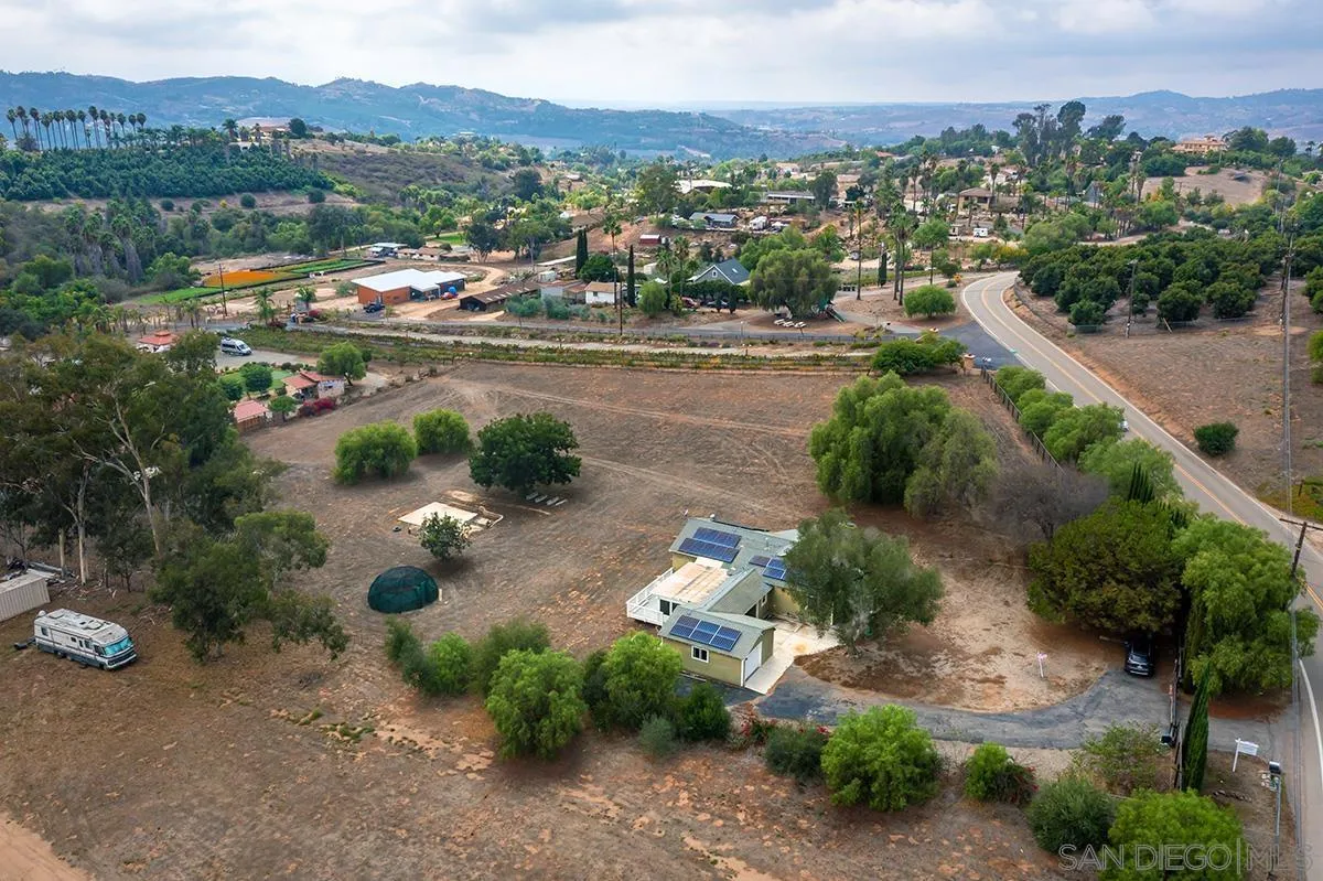 6777 West Lilac Road Bonsall, CA 92003 - Photo 4 of 36 an aerial view of a city with mountains