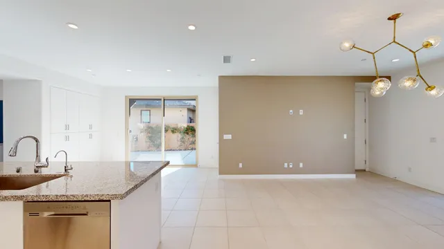 a view of an empty room with glass door