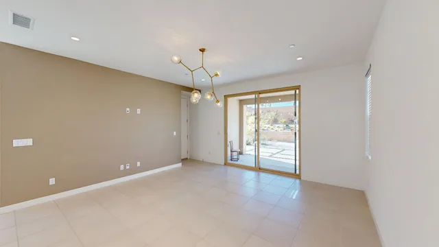 a kitchen with stainless steel appliances granite countertop a sink stove and white cabinets