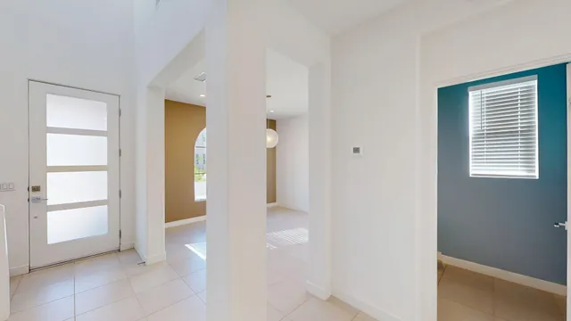 a view of an entryway with table and window
