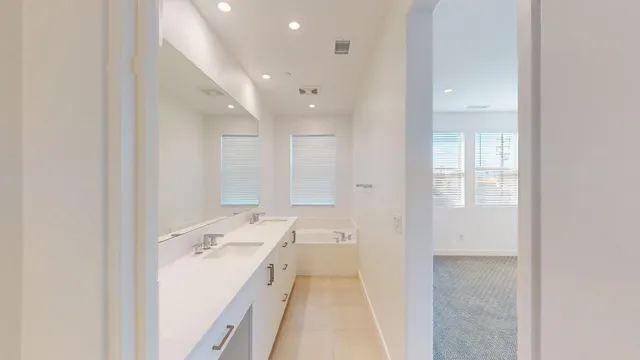 front view of a house with potted plants