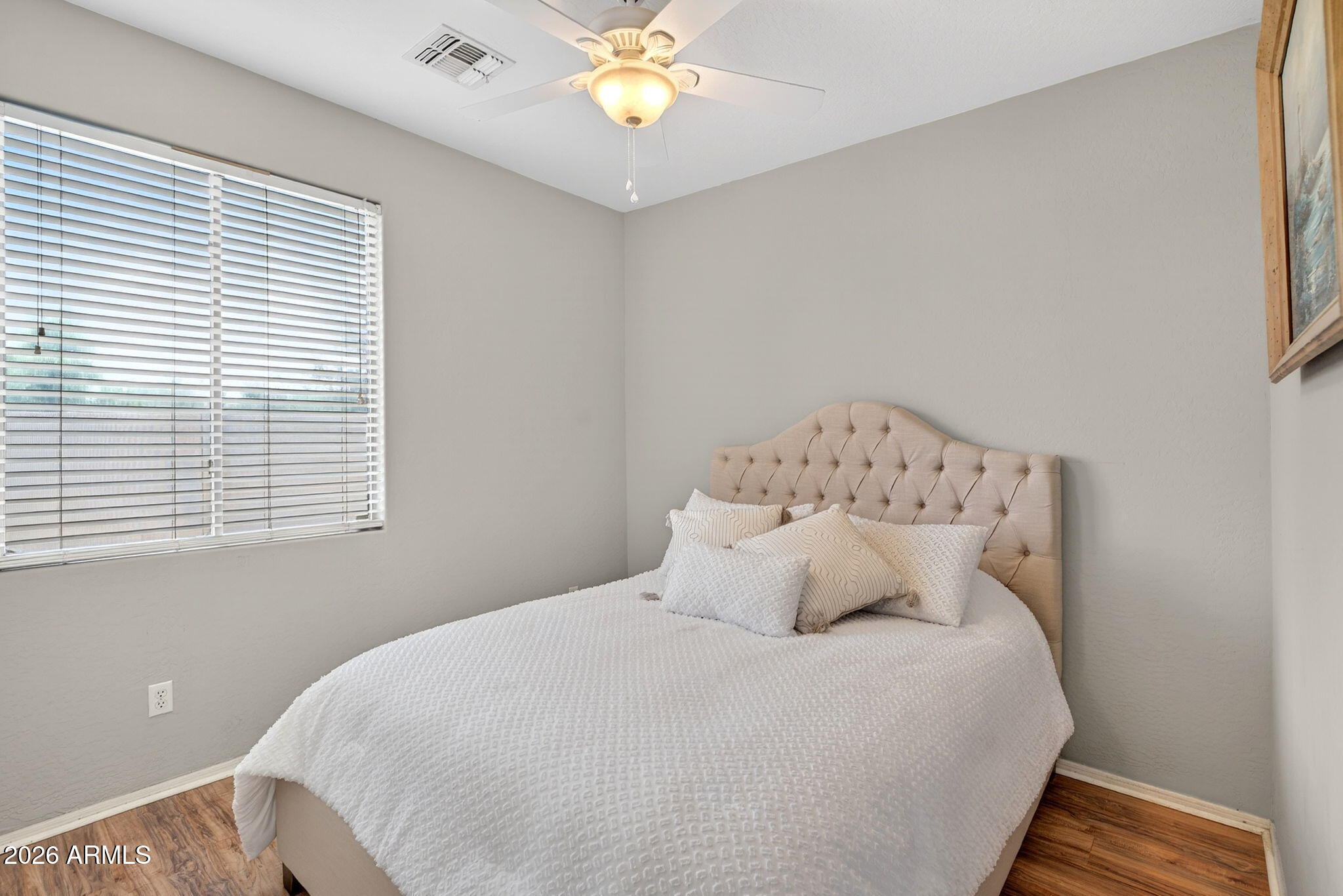 6280 South Sinova Court Gilbert, AZ 85298 - Photo 24 of 64 a bedroom with a bed and a chandelier