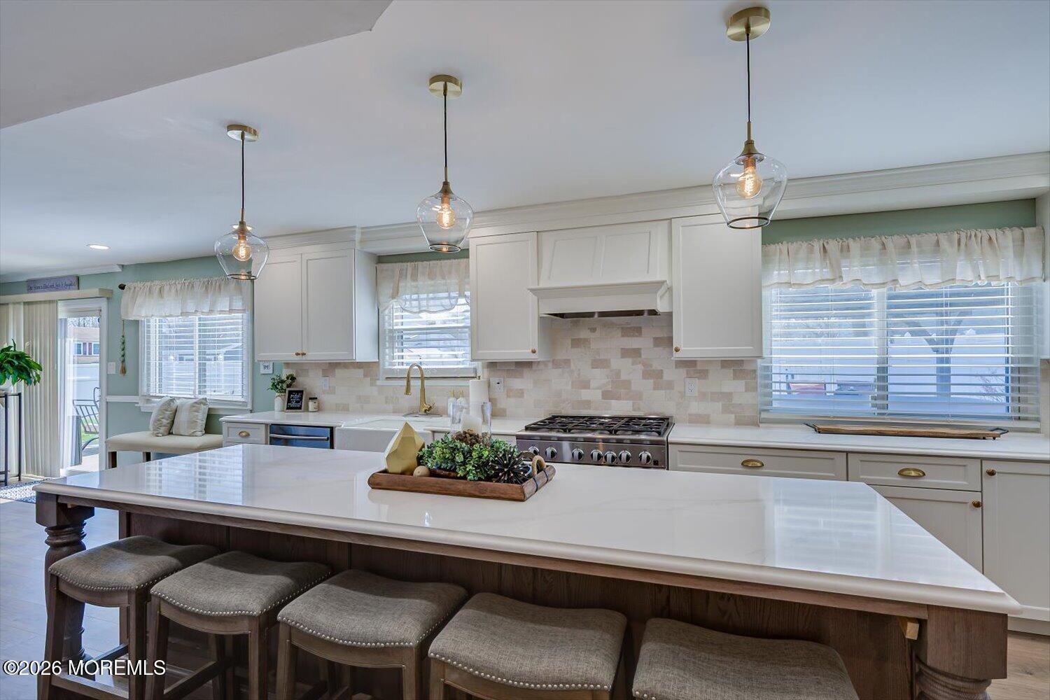 11 Quailtree Lane Howell, NJ 07731 - Photo 13 of 52 a kitchen with a table chairs stove and cabinets