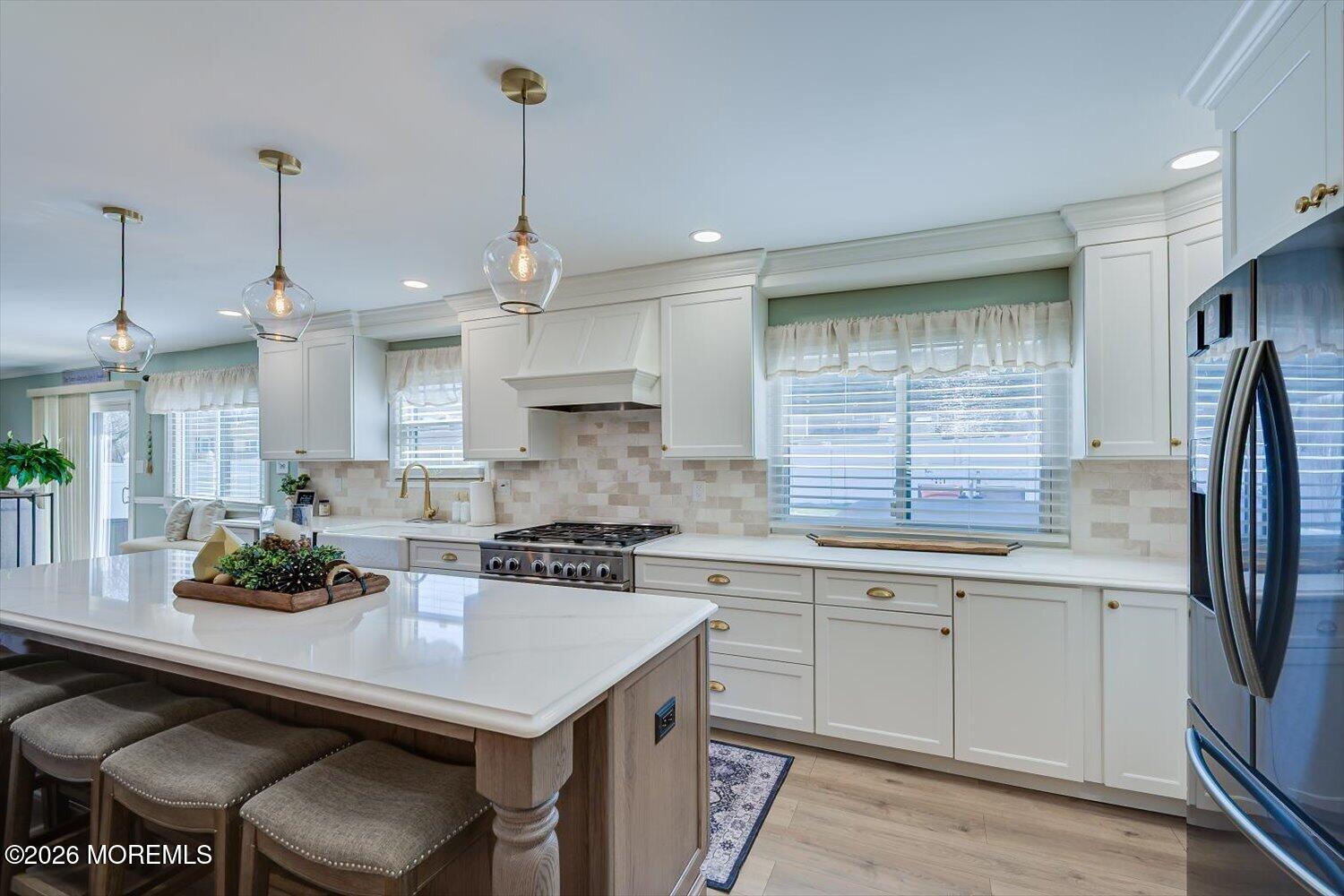 11 Quailtree Lane Howell, NJ 07731 - Photo 14 of 52 a kitchen with stainless steel appliances a sink a stove a refrigerator and cabinets