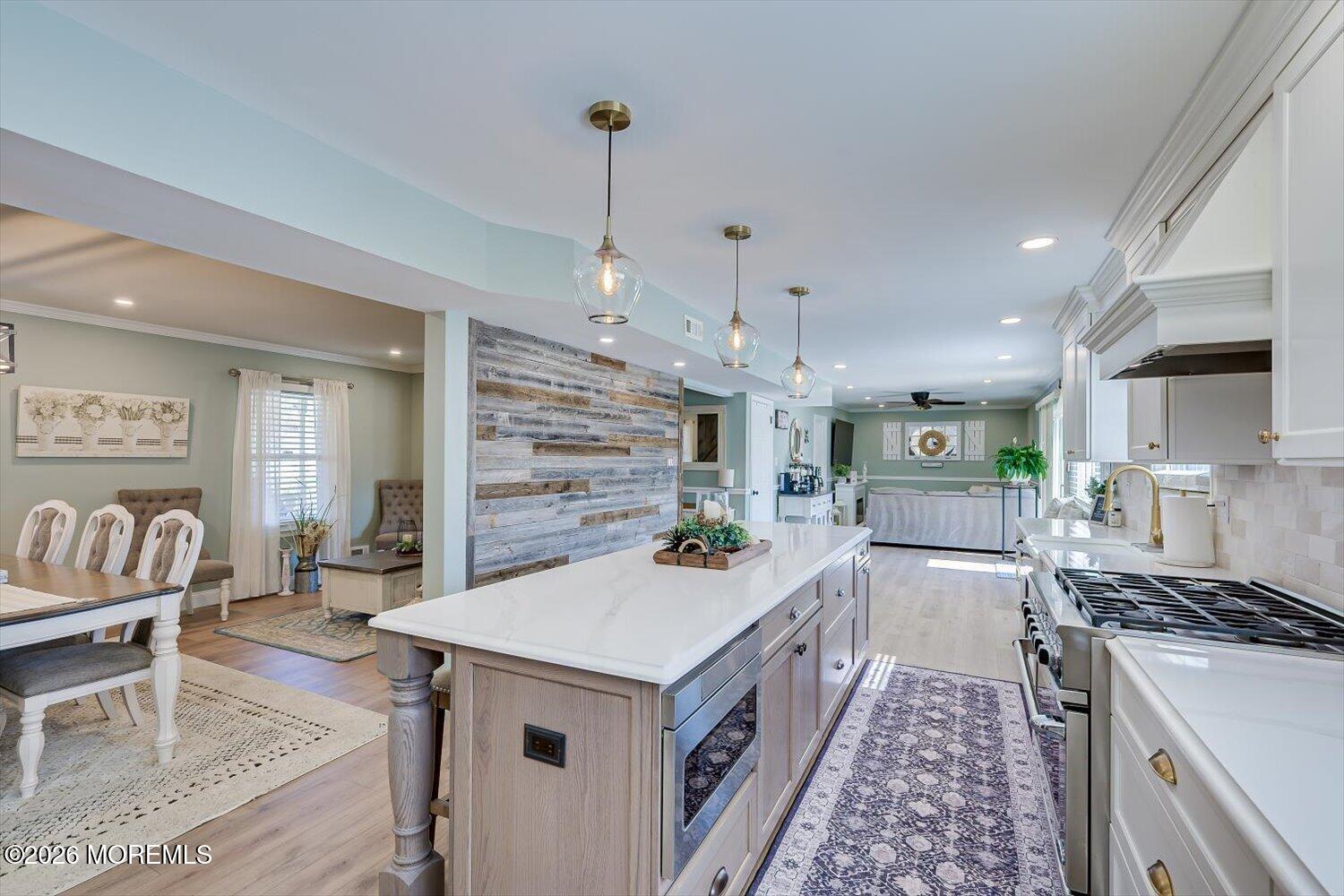 11 Quailtree Lane Howell, NJ 07731 - Photo 15 of 52 a kitchen that has a lot of cabinets in it and wooden floors