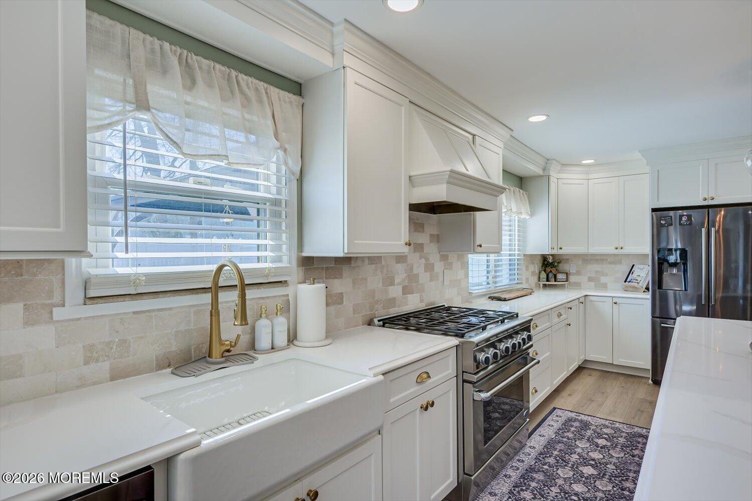11 Quailtree Lane Howell, NJ 07731 - Photo 17 of 52 a kitchen with a sink stove top oven and cabinets