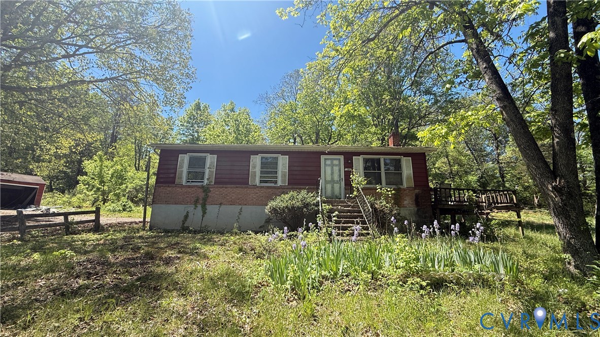 1386 Springwood Road Fincastle, VA 24090 - Photo 2 of 10 a backyard of a house with yard and outdoor seating