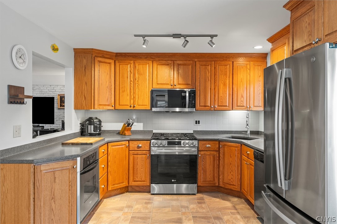 8826 Karlen Road Lee, NY 13440 - Photo 20 of 50 Sleek stainless appliances and warm wood cabinetry