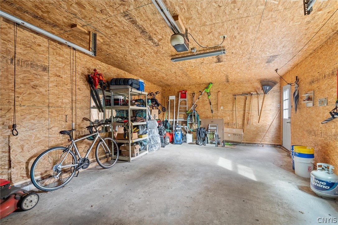 8826 Karlen Road Lee, NY 13440 - Photo 46 of 50 Spacious garage with organized storage, high ceili