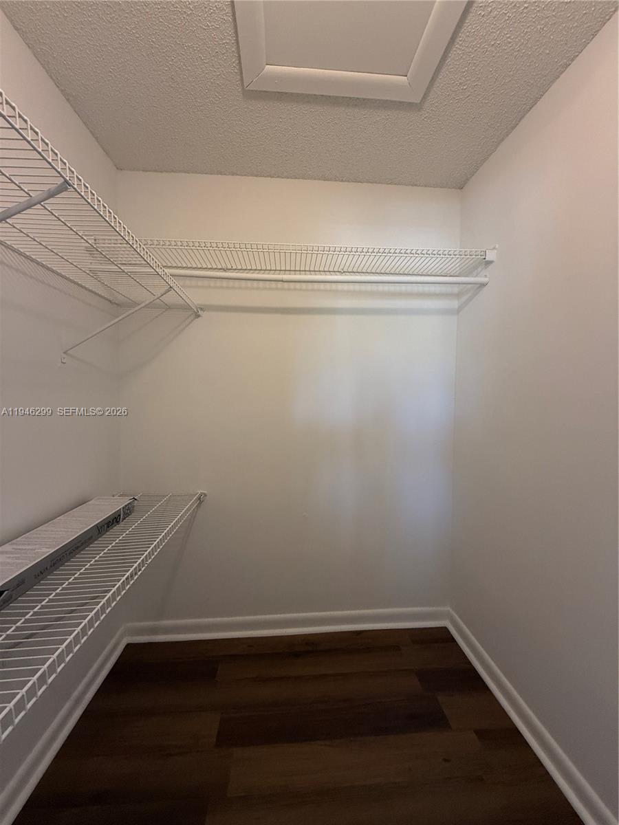 8900 West Sample Road, Unit 204 Coral Springs, FL 33065 - Photo 11 of 21 a view of a room with racks on the wall