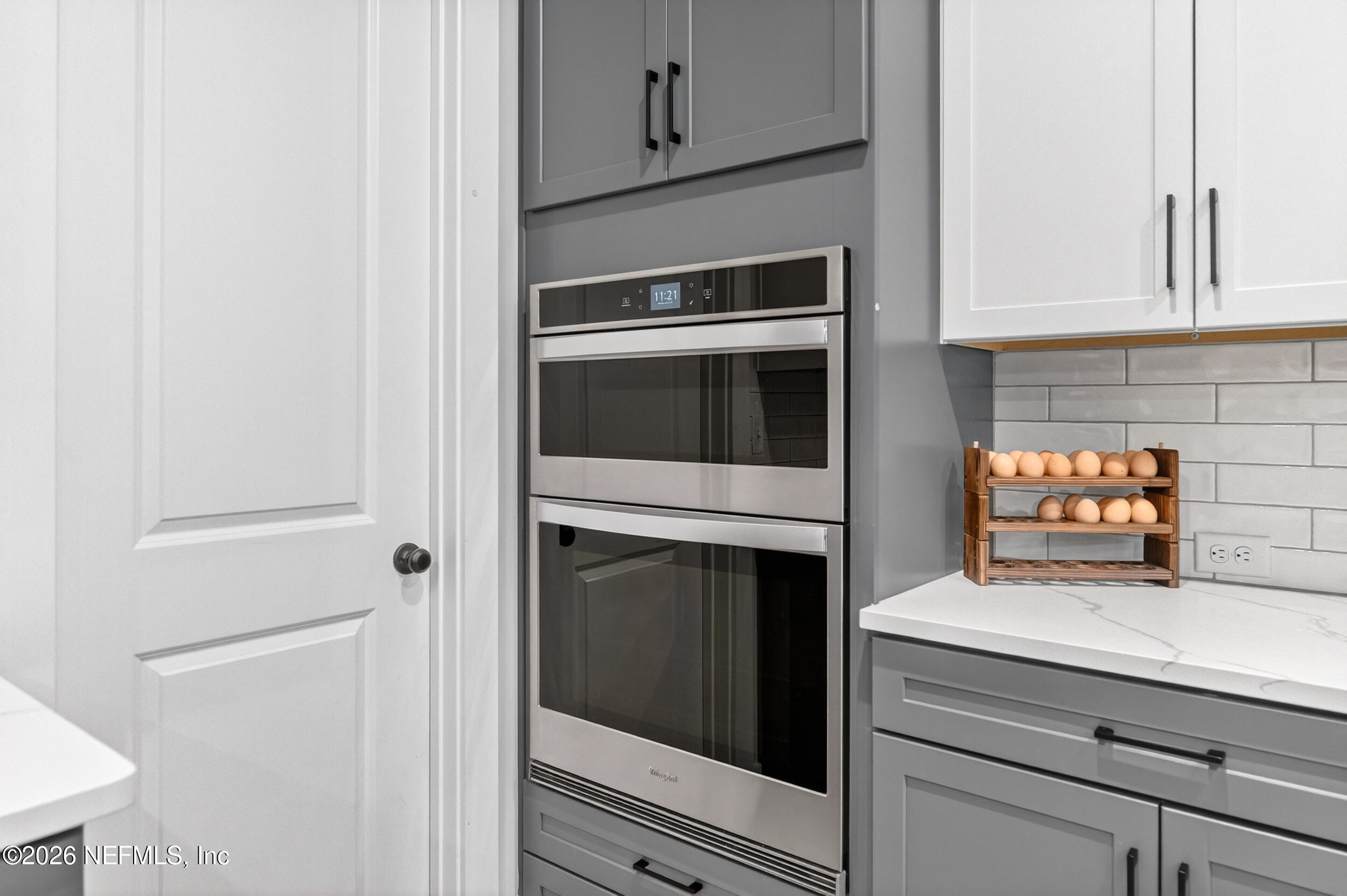 4028 Little Bit Court Middleburg, FL 32068 - Photo 13 of 47 a kitchen with stainless steel appliances white cabinets and a stove