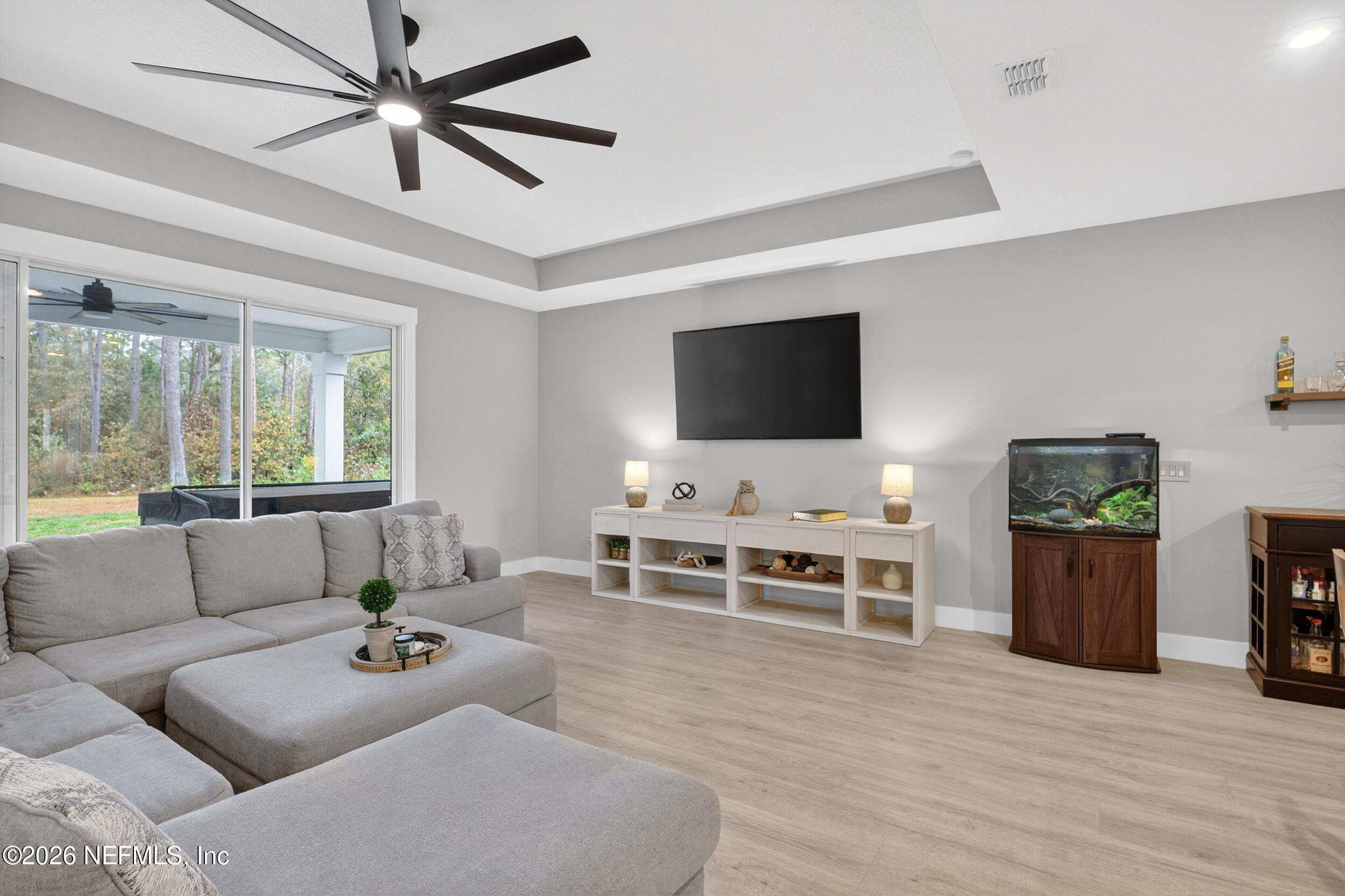 4028 Little Bit Court Middleburg, FL 32068 - Photo 18 of 47 a living room with furniture and a flat screen tv