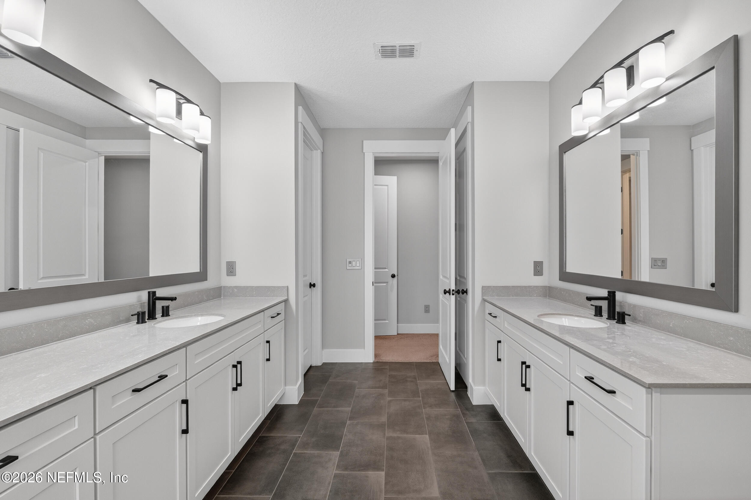 4028 Little Bit Court Middleburg, FL 32068 - Photo 26 of 47 a spacious bathroom with double sink and a large mirror