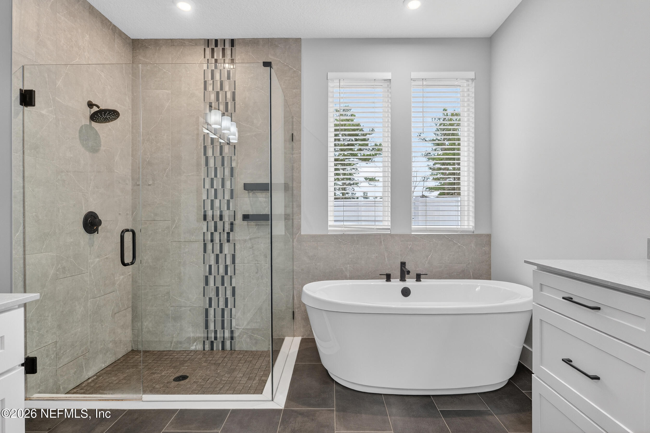 4028 Little Bit Court Middleburg, FL 32068 - Photo 27 of 47 a white bath tub sitting next to a bathroom sink