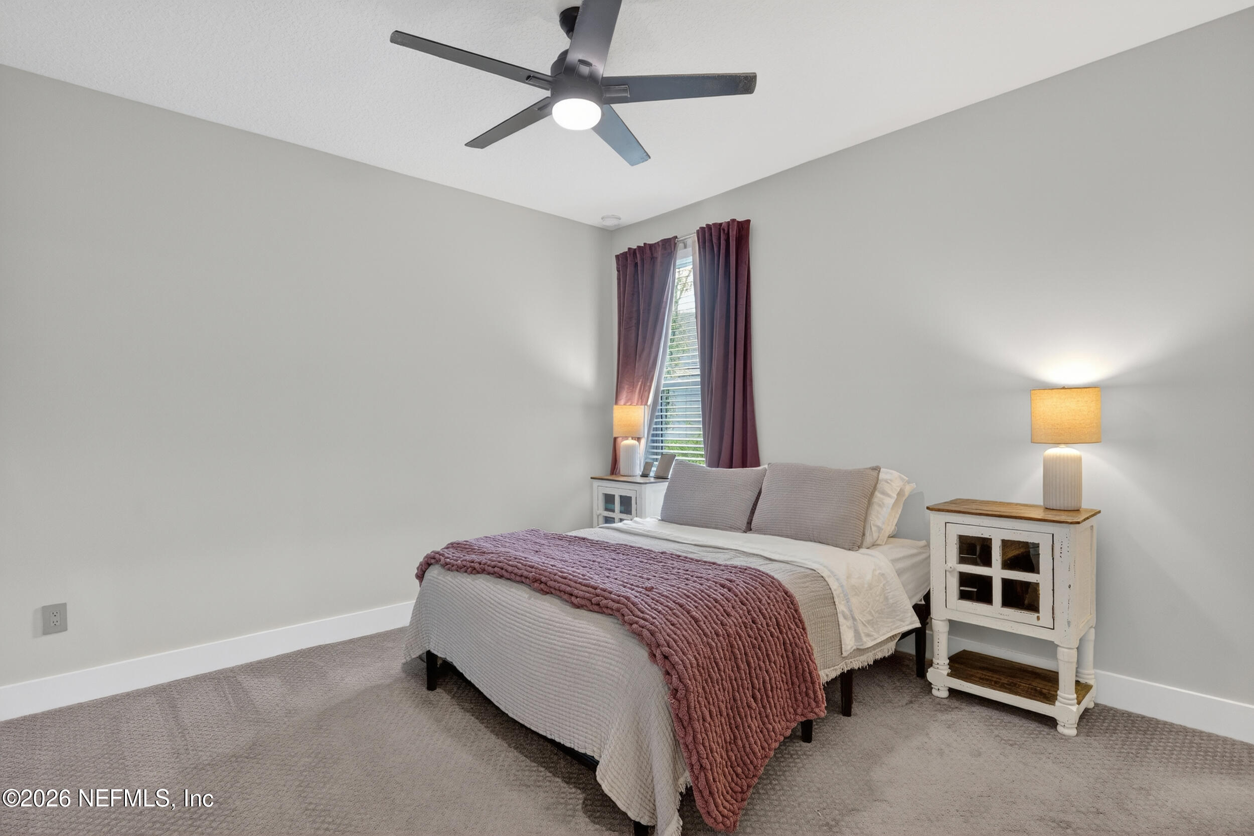 4028 Little Bit Court Middleburg, FL 32068 - Photo 28 of 47 a bedroom with a bed and a chandelier