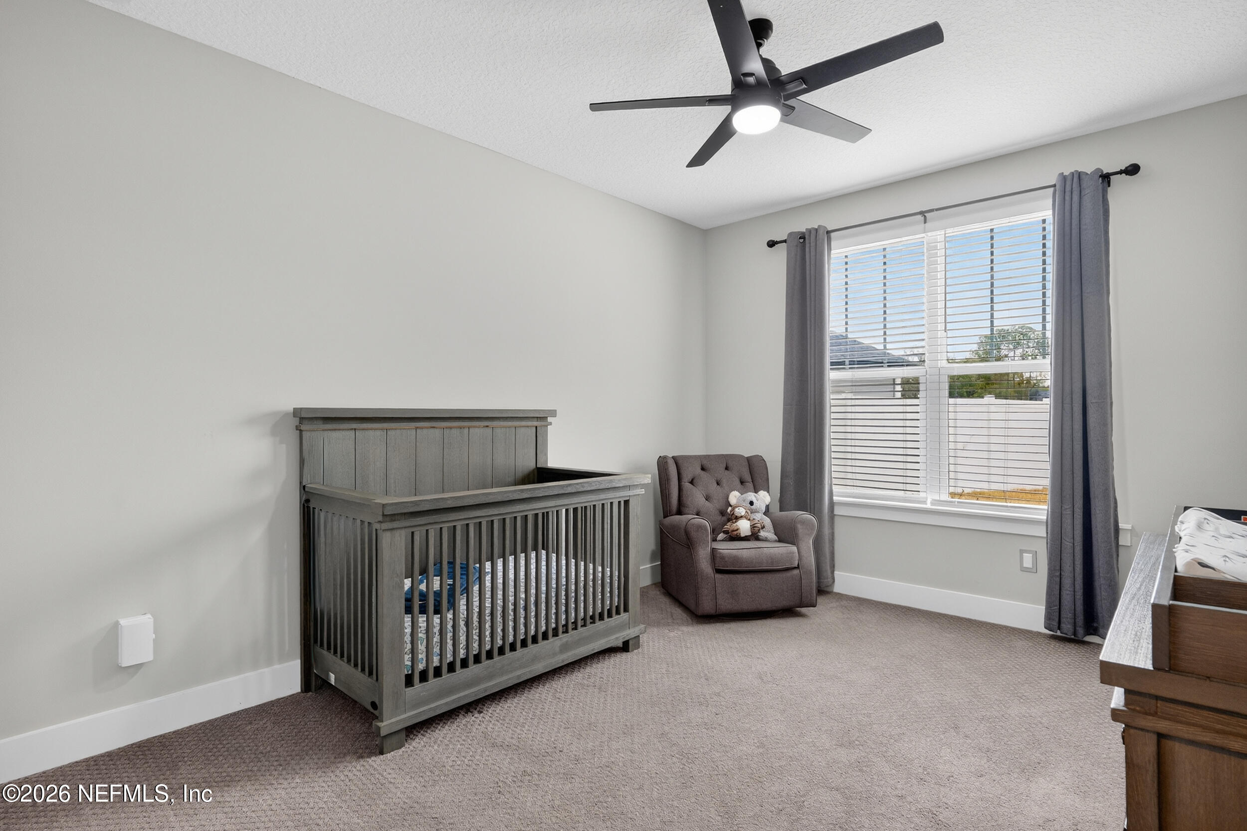 4028 Little Bit Court Middleburg, FL 32068 - Photo 29 of 47 a bedroom with a bed and a window