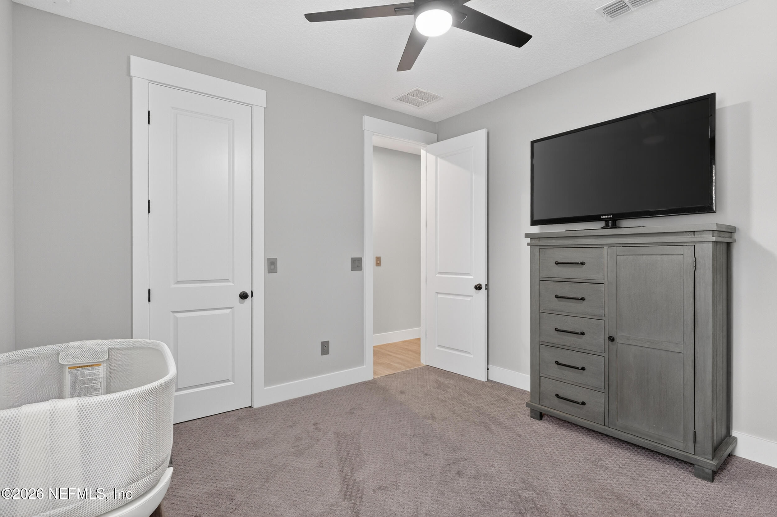 4028 Little Bit Court Middleburg, FL 32068 - Photo 30 of 47 a living room with furniture and a flat screen tv