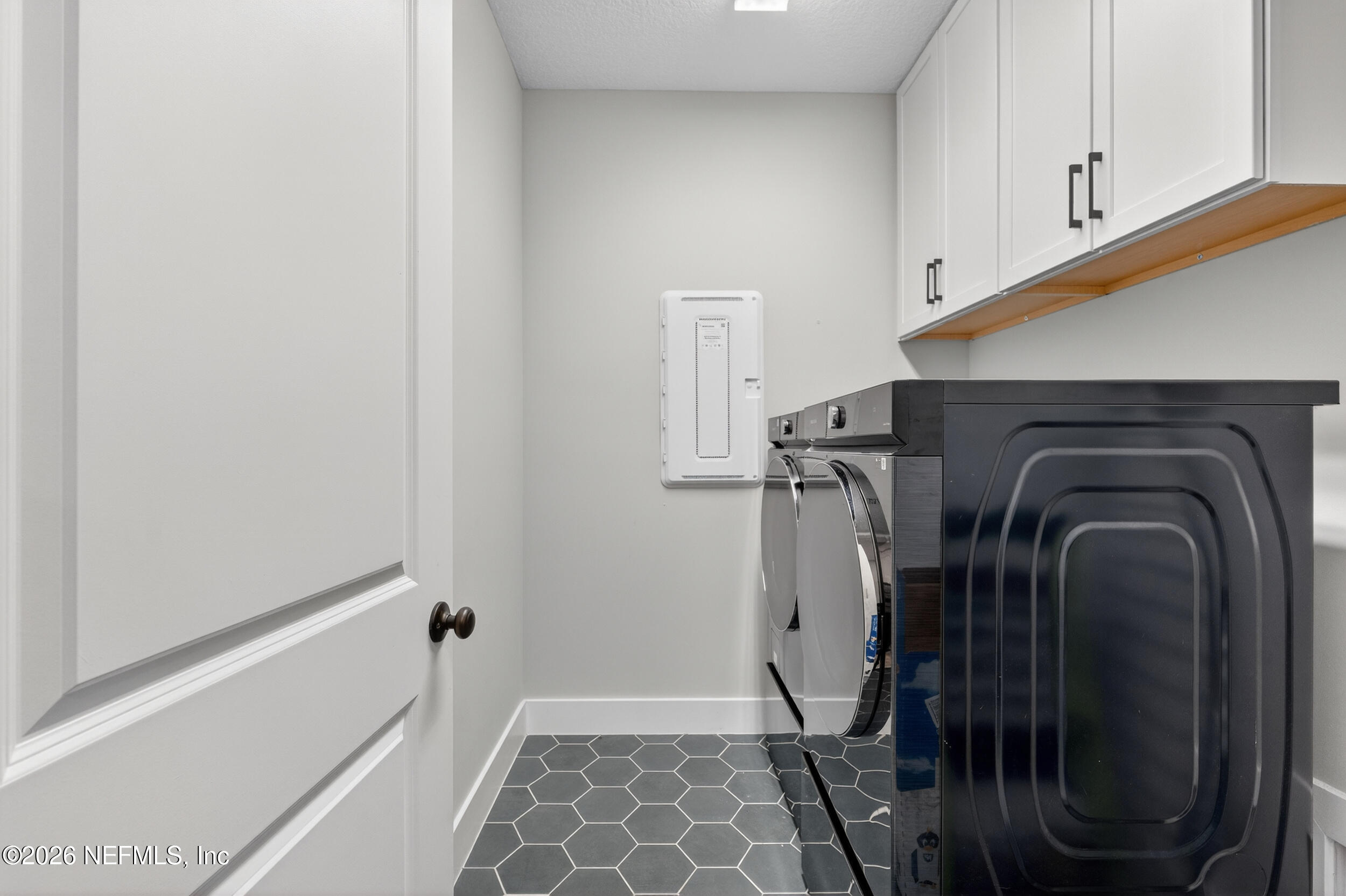 4028 Little Bit Court Middleburg, FL 32068 - Photo 34 of 47 a view of walk in closet with clothes and shoes