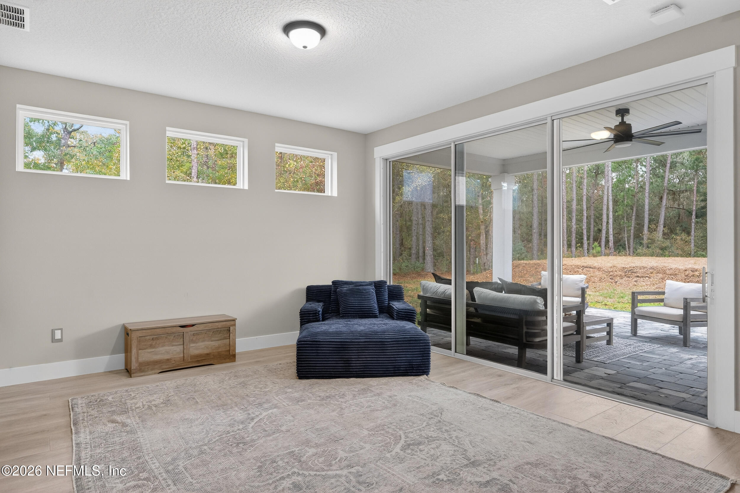 4028 Little Bit Court Middleburg, FL 32068 - Photo 36 of 47 a living room with furniture and a large window