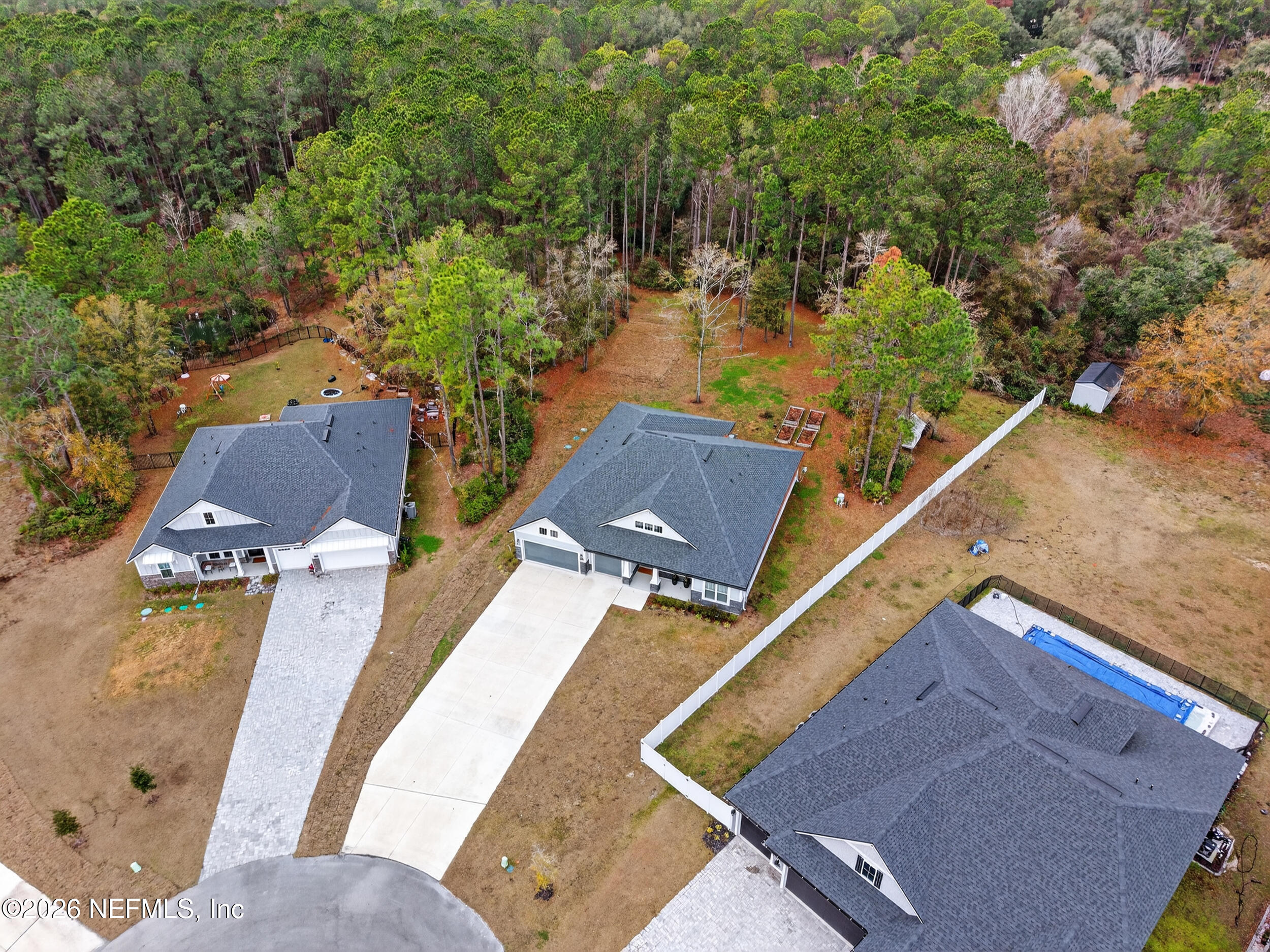 4028 Little Bit Court Middleburg, FL 32068 - Photo 45 of 47 an aerial view of residential houses with outdoor space
