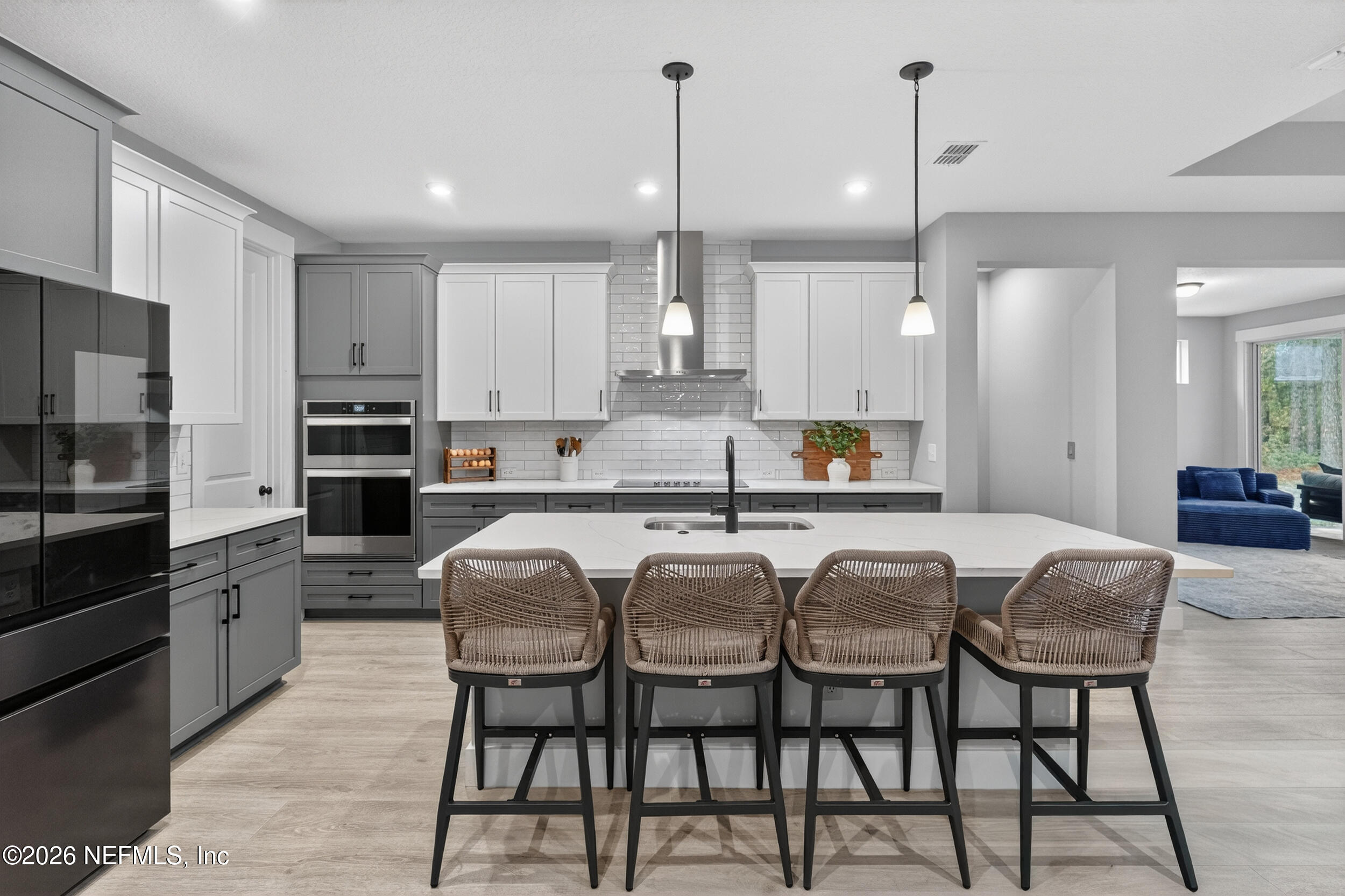 4028 Little Bit Court Middleburg, FL 32068 - Photo 7 of 47 a large kitchen with granite countertop lots of counter space and stainless steel appliances