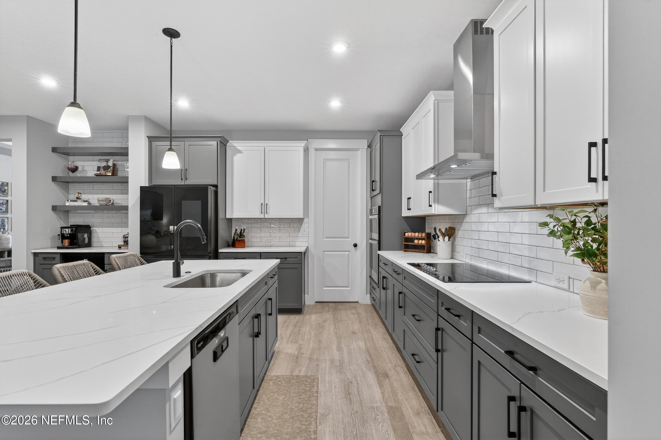4028 Little Bit Court Middleburg, FL 32068 - Photo 8 of 47 a kitchen with stainless steel appliances kitchen island granite countertop a sink a stove and cabinets