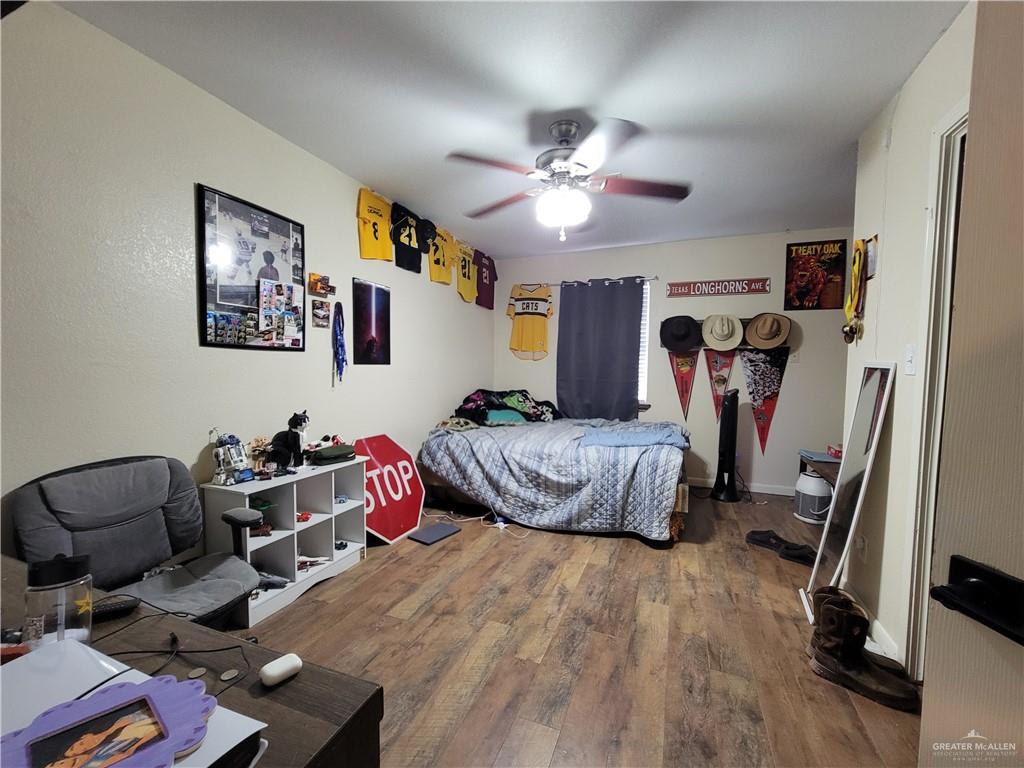 206 South Arroyo Boulevard Rio Hondo, TX 78583 - Photo 26 of 42 3rd Bedroom with ceiling fan and dark wood-style flooring