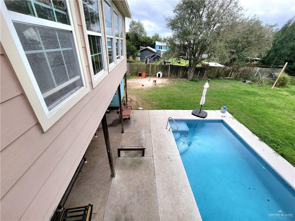 206 South Arroyo Boulevard Rio Hondo, TX 78583 - Photo 3 of 42 View of swimming pool featuring a fenced backyard and a patio