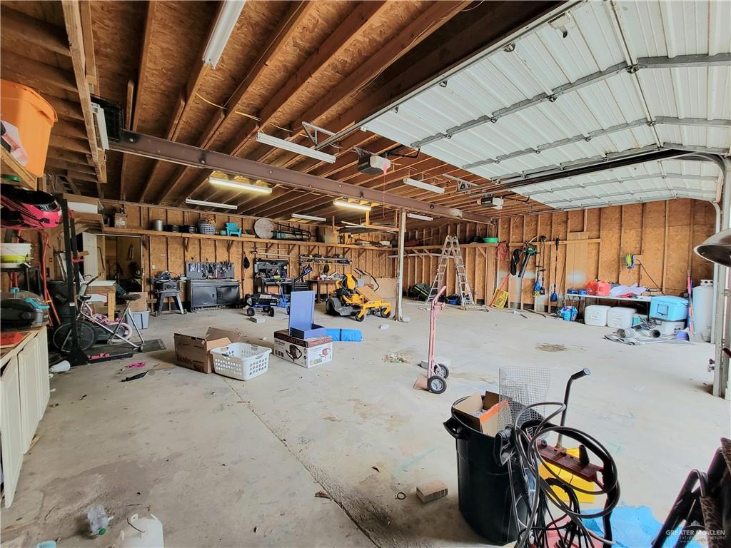 206 South Arroyo Boulevard Rio Hondo, TX 78583 - Photo 37 of 42 Garage featuring a garage door opener