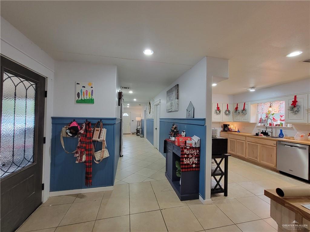 206 South Arroyo Boulevard Rio Hondo, TX 78583 - Photo 4 of 42 Corridor featuring healthy amount of natural light, light tile patterned floors, and recessed lighting
