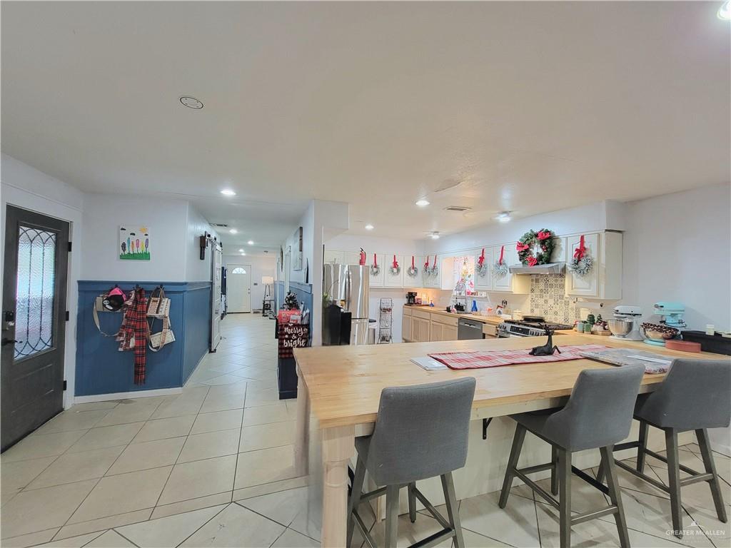 206 South Arroyo Boulevard Rio Hondo, TX 78583 - Photo 5 of 42 Dining room featuring plenty of natural light, recessed lighting, and light tile patterned floors
