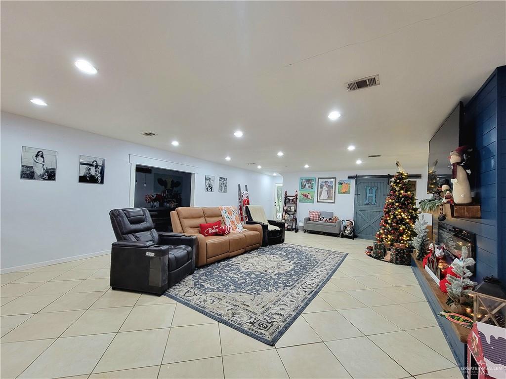 206 South Arroyo Boulevard Rio Hondo, TX 78583 - Photo 10 of 42 Living room featuring recessed lighting and light tile patterned floors