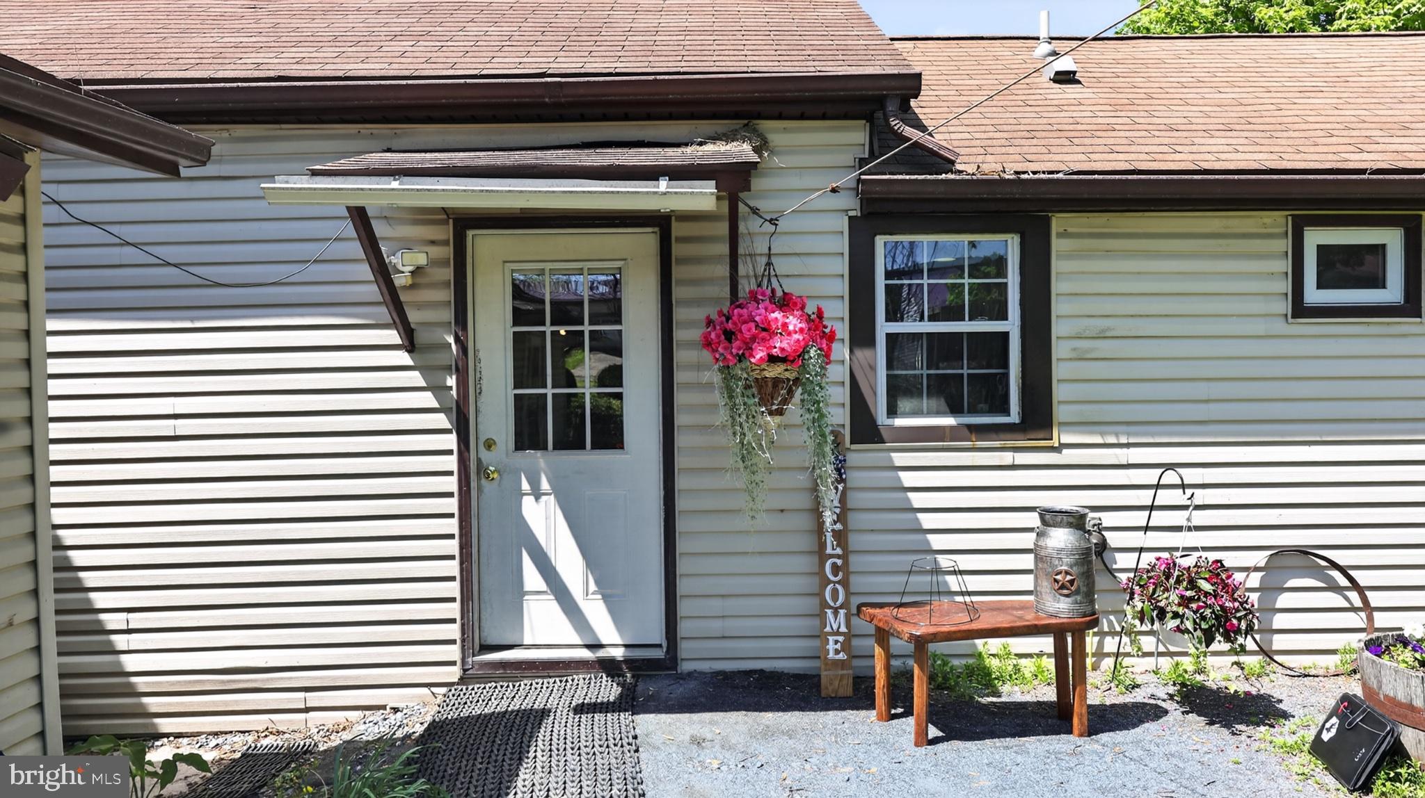 1599 Sanctuary Road Manheim, PA 17545 - Photo 40 of 66 Charming entrance with vibrant blooms.