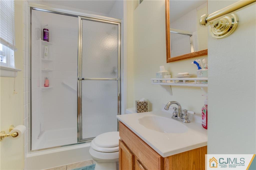16 Fulton Road Somerset, NJ 08873 - Photo 14 of 25 a bathroom with a sink toilet and shower