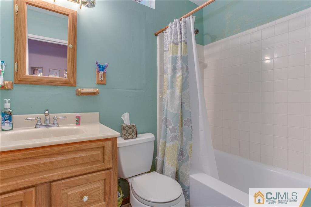 16 Fulton Road Somerset, NJ 08873 - Photo 18 of 25 a bathroom with a sink a toilet and shower