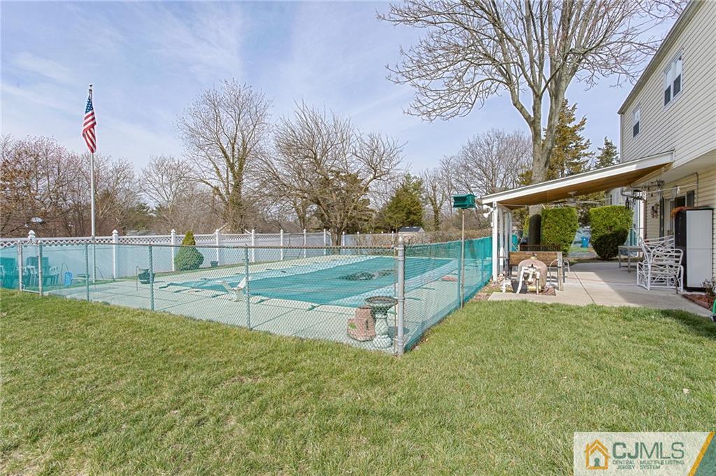 16 Fulton Road Somerset, NJ 08873 - Photo 24 of 25 a view of a backyard with swings
