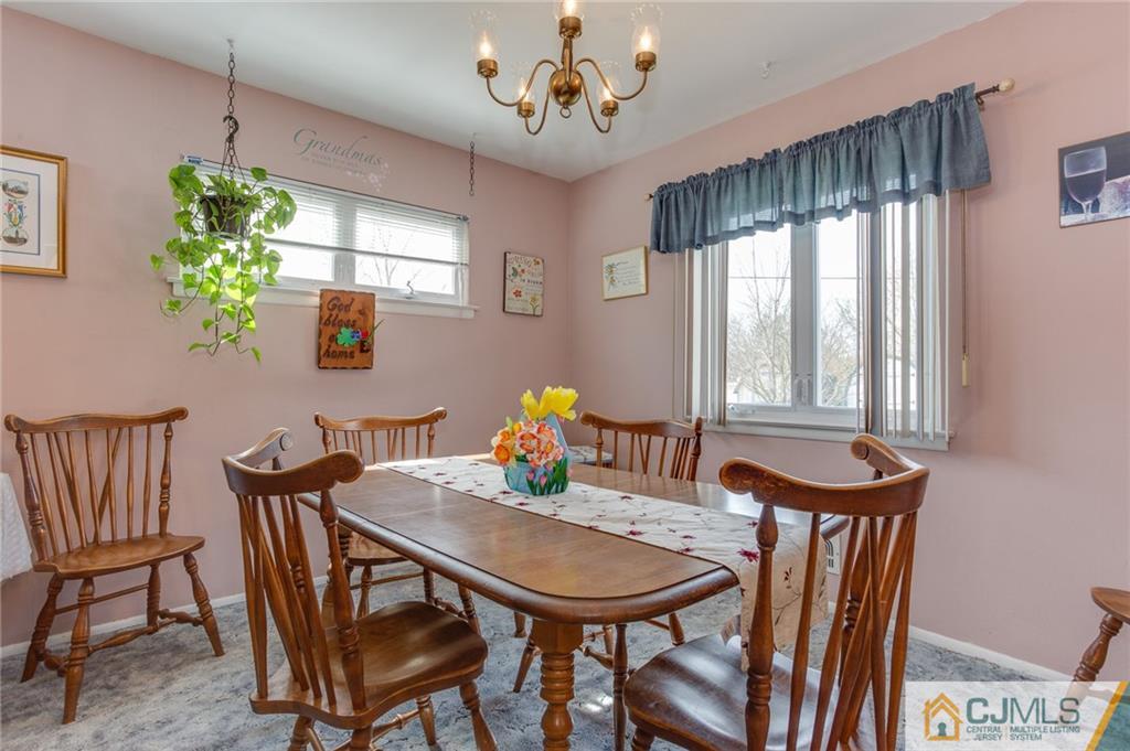 16 Fulton Road Somerset, NJ 08873 - Photo 5 of 25 a view of a dining room with furniture window and wooden floor