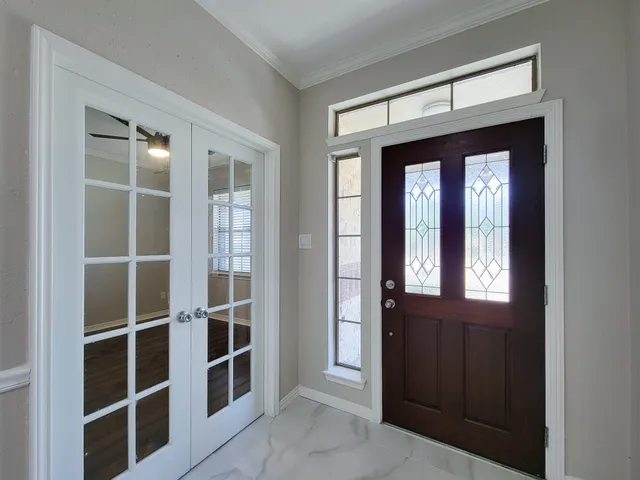 a view of a livingroom with furniture and windows
