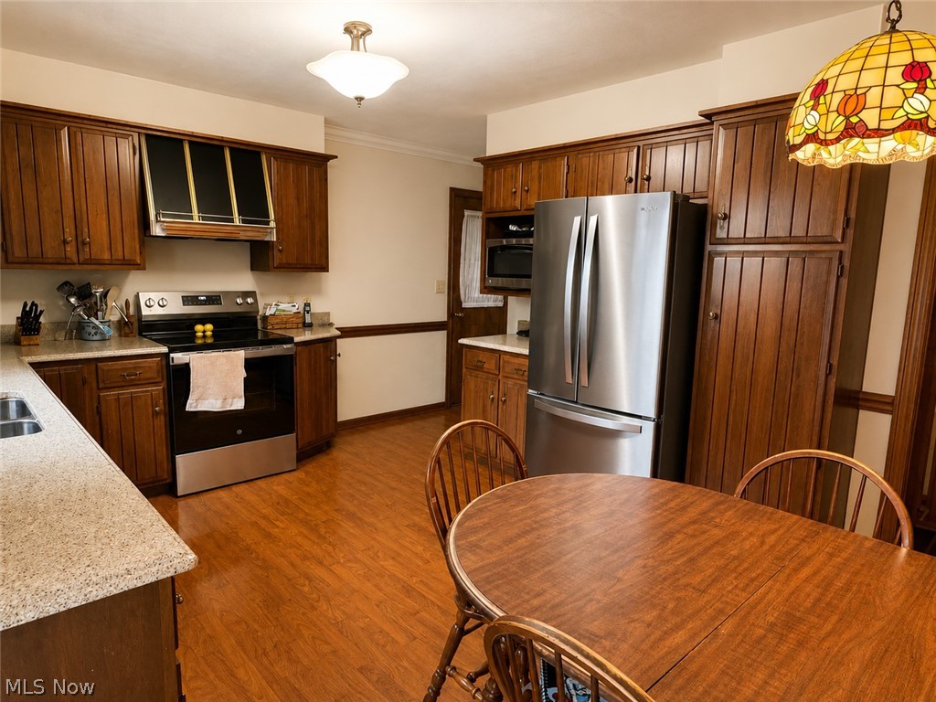 6155 Gibson Road Canfield, OH 44406 - Photo 20 of 43 Kitchen featuring wood-finish cabinetry and flooring