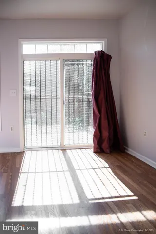 a view of a room with a floor to ceiling window