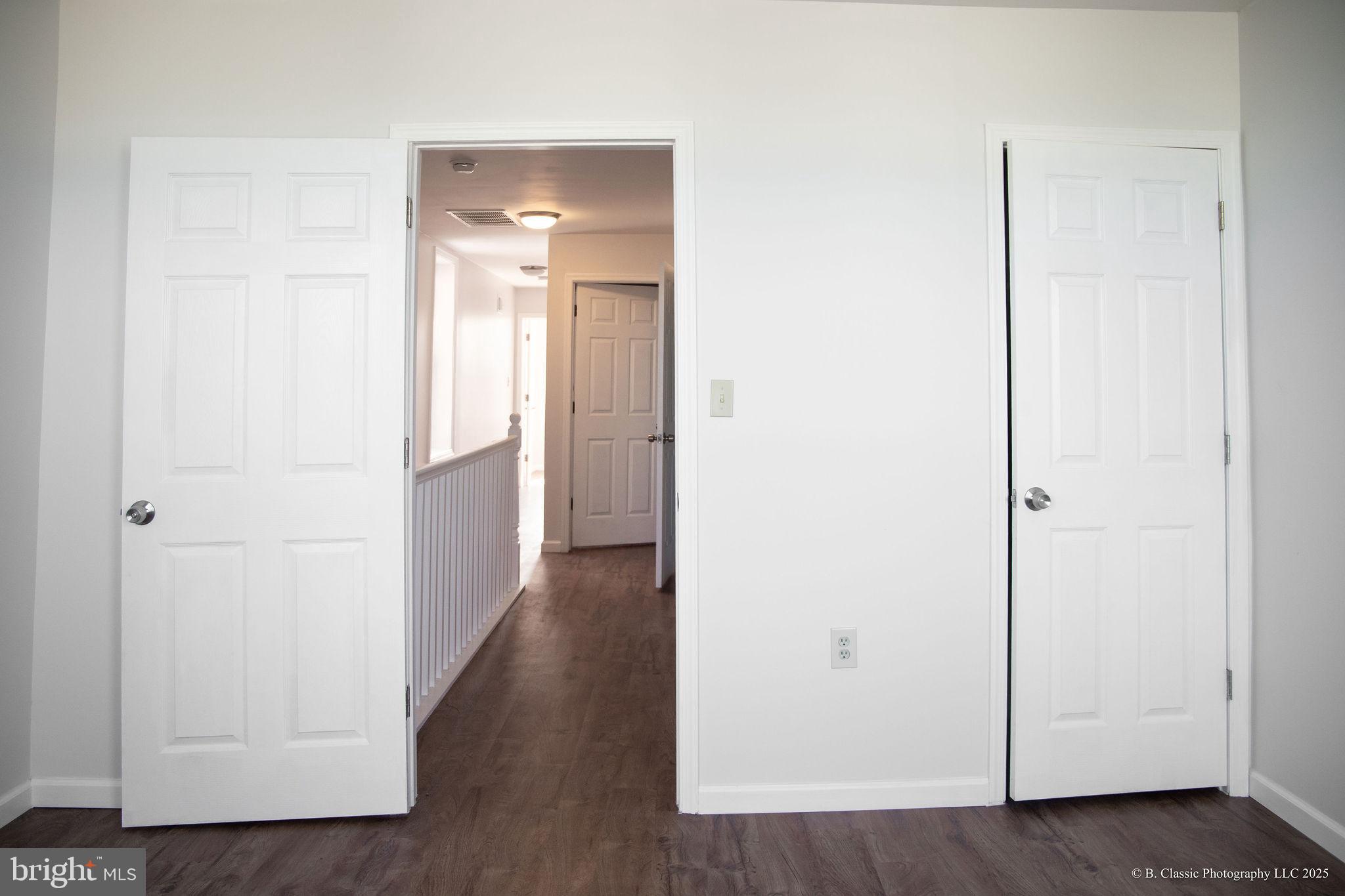 3035 West Belvedere Avenue Baltimore, MD 21215 - Photo 19 of 49 a view of a hallway with wooden floor