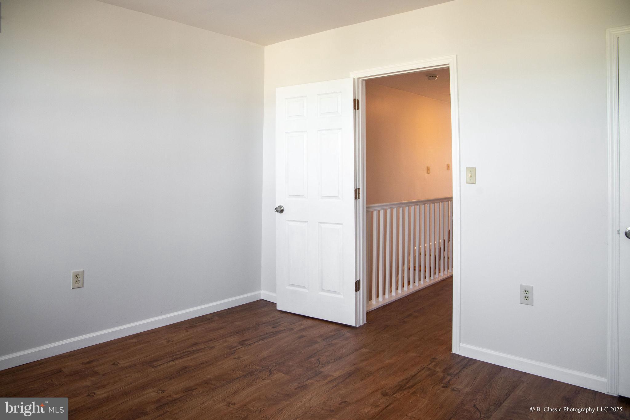 3035 West Belvedere Avenue Baltimore, MD 21215 - Photo 20 of 49 an empty room with wooden floor