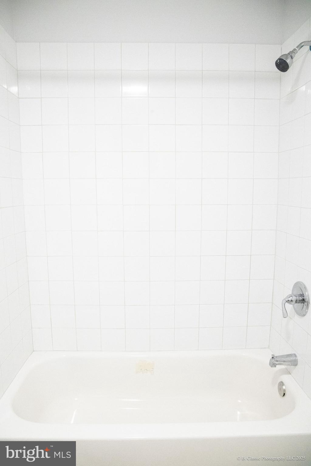 3035 West Belvedere Avenue Baltimore, MD 21215 - Photo 23 of 49 a bathroom with a bathtub