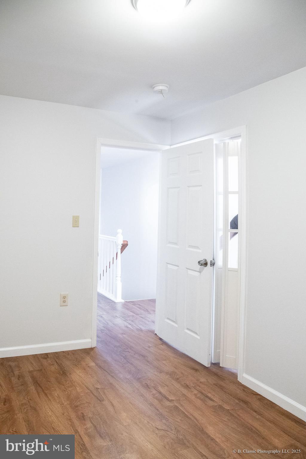 3035 West Belvedere Avenue Baltimore, MD 21215 - Photo 28 of 49 a view of an empty room with wooden floor