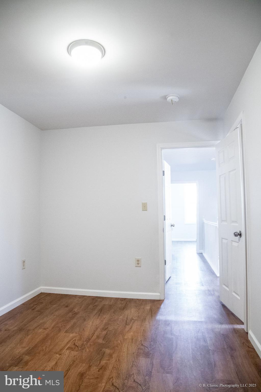3035 West Belvedere Avenue Baltimore, MD 21215 - Photo 29 of 49 wooden floor in an empty room