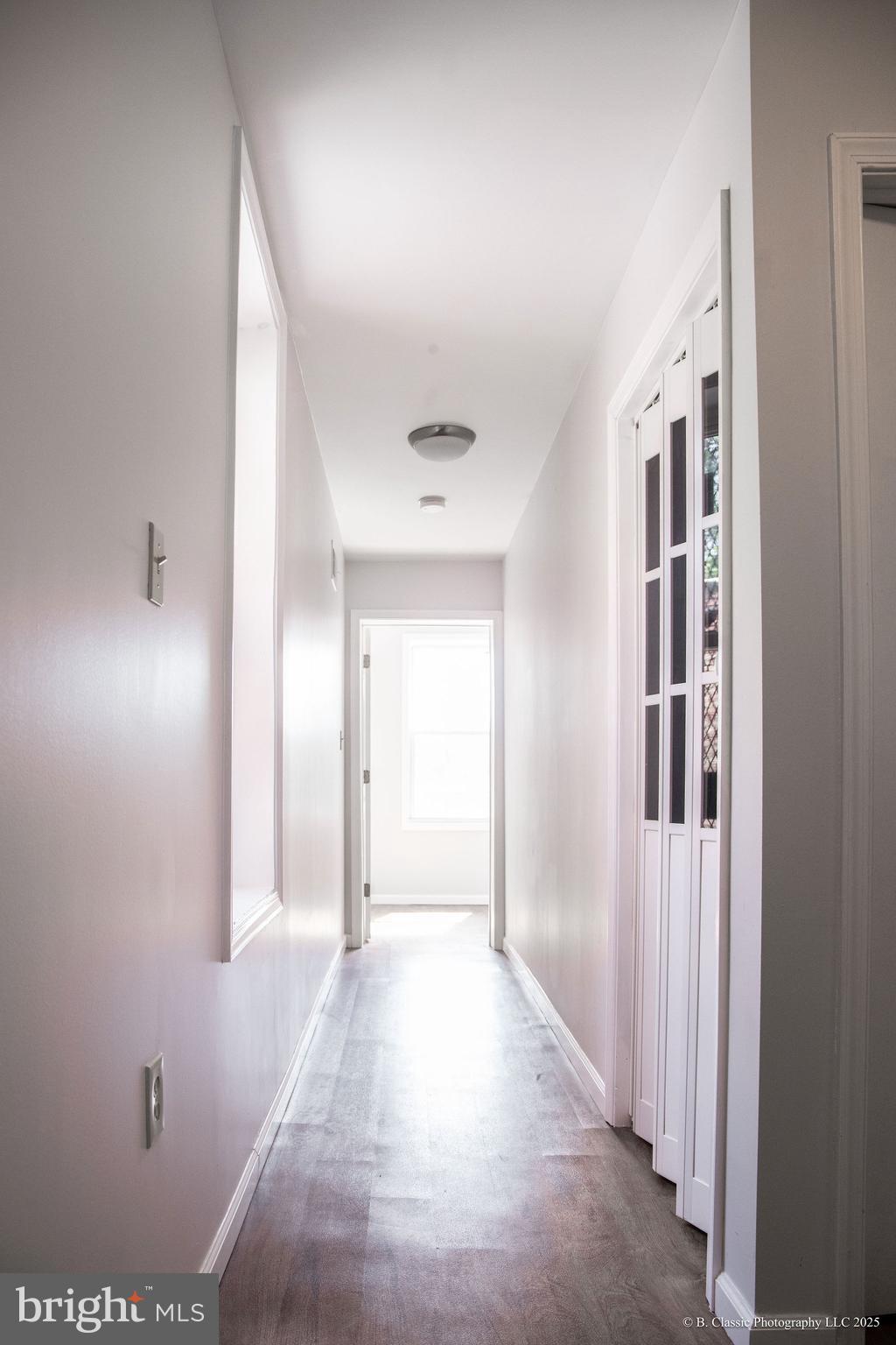 3035 West Belvedere Avenue Baltimore, MD 21215 - Photo 30 of 49 a view of a hallway with wooden shelves