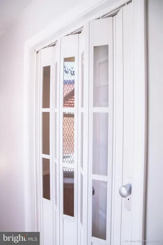 a bathroom with a shower and a door